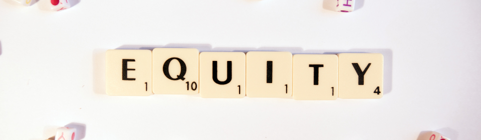 the word "equity" spelled out with several dices
